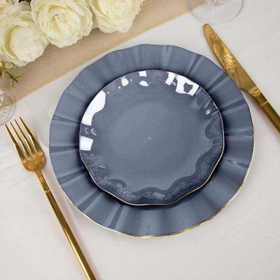 Elegant gray plates with gold trim on a stylish table setting.