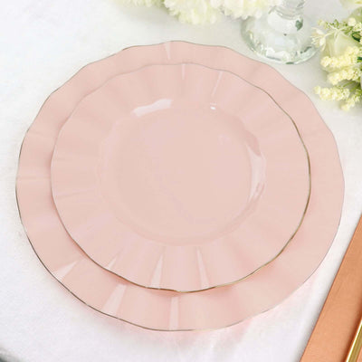 Pink scalloped dinner plates with gold trim