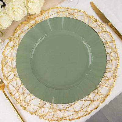 Green decorative plate on a gold wire charger with elegant table setting.