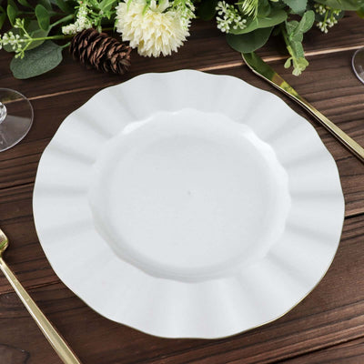 Elegant white plate with a scalloped edge on a rustic wooden table.
