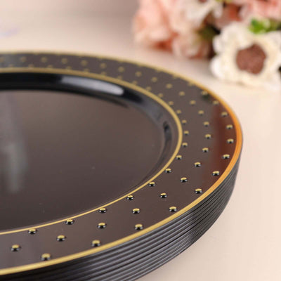 Elegant black plate with gold accents and dotted design.