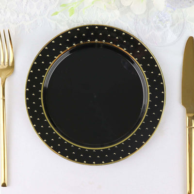 Elegant black plate with gold studs, perfect for formal dining.