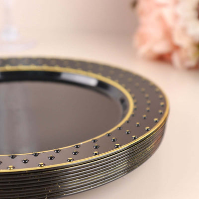 Elegant black plate with gold detailing and bead accents.
