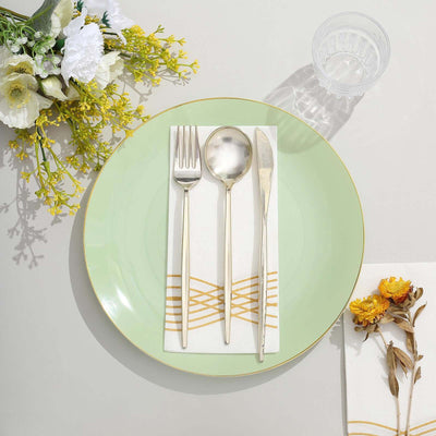 Elegant table setting with silver cutlery on a pastel green plate.