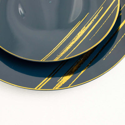 Dark blue plates with gold stripes in a stacked arrangement.