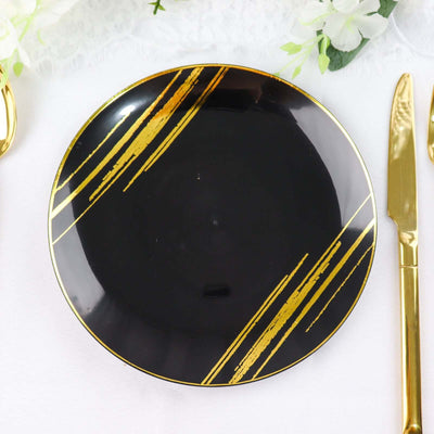 Black plate with gold stripes and a glossy finish, perfect for elegant dining.