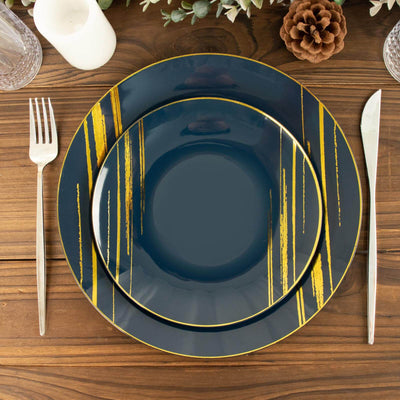 Elegant navy blue plates with gold accents on a wooden table setting.