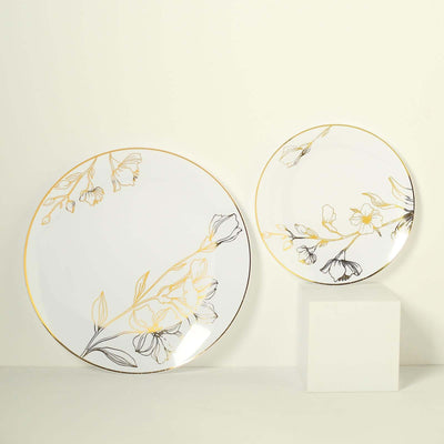 Elegant floral-designed dinner plates in gold and black on a light backdrop.