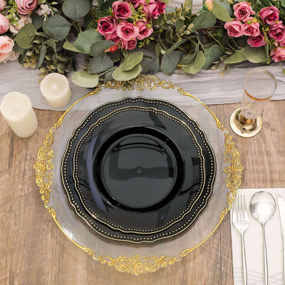 Elegant black and gold decorative plates set on a rustic wooden table.