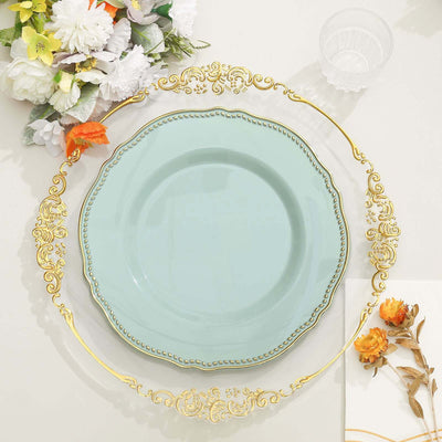 Elegant mint green plate with ornate gold trim, styled with floral accents.