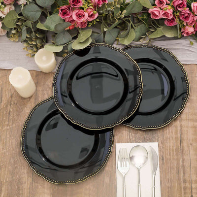 Elegant black plates with gold trim, perfect for dining or events.
