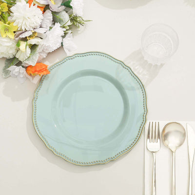 Light blue decorative plate with gold trim on a neutral table setting.