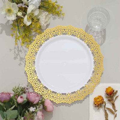 Elegant gold lace dinner plate on a table with flowers and glass