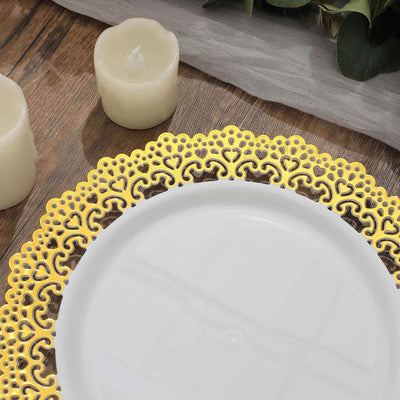 Elegant gold lace charger plate on a wooden table with candles.