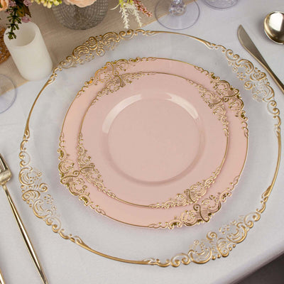 Elegant pink and gold decorative plates stacked on a table setting.