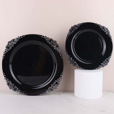 Black decorative plates with intricate edges on a light background.