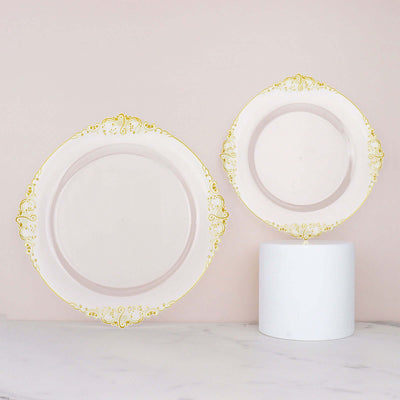 Elegant decorative plates with gold accents on a soft pink background.