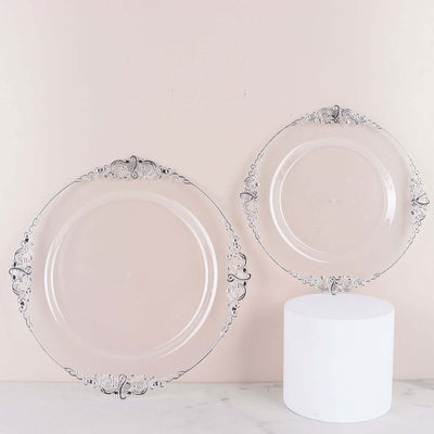 Elegant decorative plates with intricate silver detailing on a soft background.