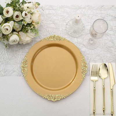 Elegant gold charger plate with ornate design, set on a festive table setting.