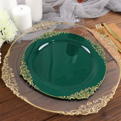 Green decorative plate with gold trim on a clear charger plate.
