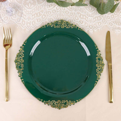 Elegant green decorative plate with gold accents and gold cutlery.