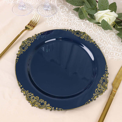 Navy blue decorative plate with gold trim on a beige table setting.