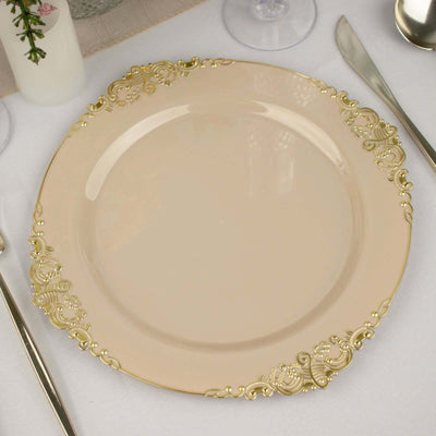 Elegant beige plate with gold ornate rim on a dining table setting.