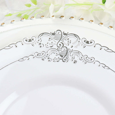 Elegant white porcelain plate with intricate silver detailing.