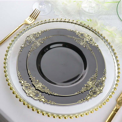 Elegant black and gold dinner plate set on a decorative table setting.