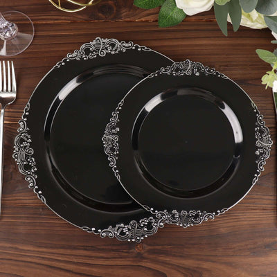 Black decorative plates set with intricate white lace border patterns.