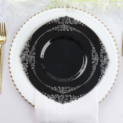 Elegant black decorative plate on a white table setting.