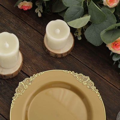 Elegant gold decorative plate with ornate border, surrounded by candles and greenery.