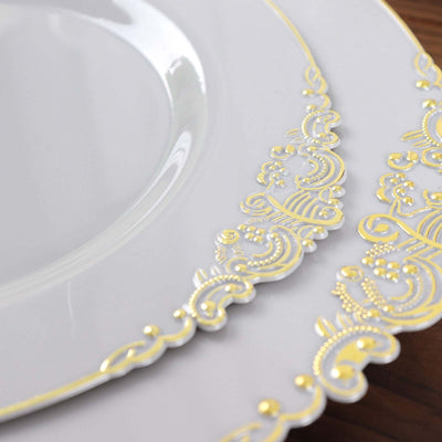 Elegant white plates with intricate gold detailing.