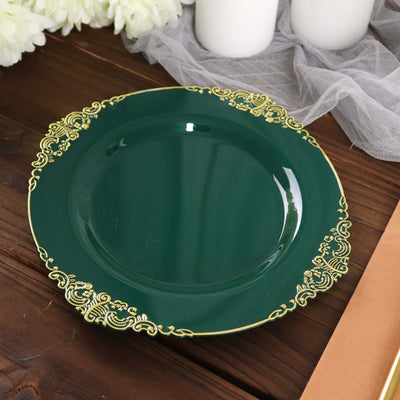 Green decorative plate with gold accents on a wooden table.
