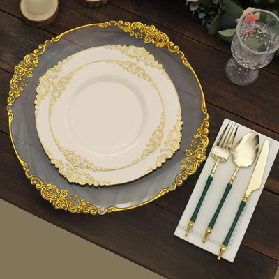 Elegant gold-accented dinnerware set on a wooden table.