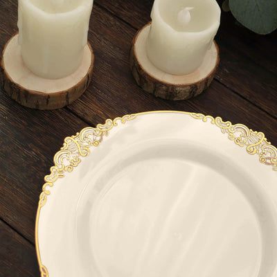 Elegant white plate with gold trim, styled with candles on a wooden table.