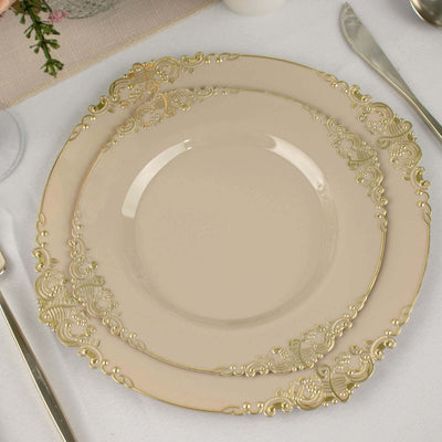 Elegant cream plates with gold filigree design on a white table setting.