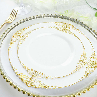 Elegant white plate with gold ornate design on a decorative charger.