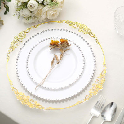 Elegant decorative plates with flowers, arranged on a soft table setting.