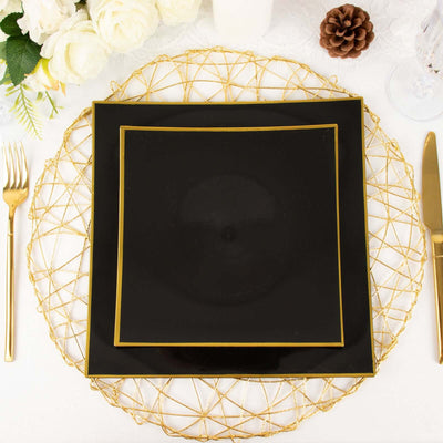 Black and gold dinnerware set with decorative charger plate