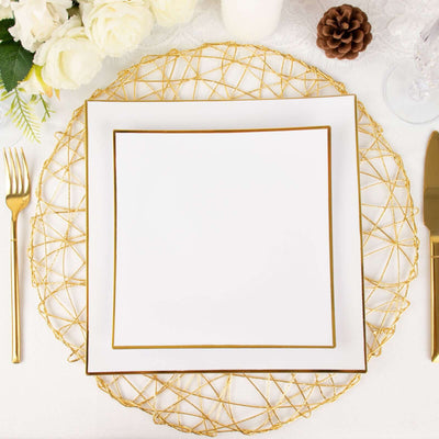 Elegant white plate with gold trim on decorative charger, set for a refined dining experience.