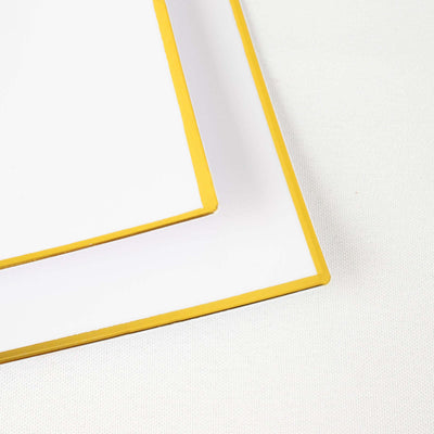 White frame with yellow edges on a plain background