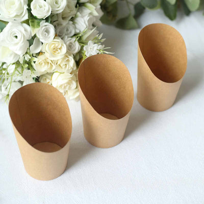 Three eco-friendly kraft paper cups on a white surface