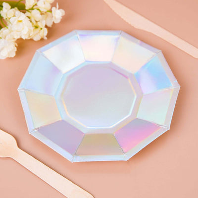 Iridescent octagonal plate with decorative edges on a beige background.