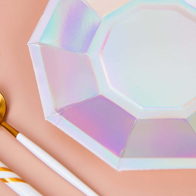 Iridescent octagonal plate with gold spoon and striped straw.