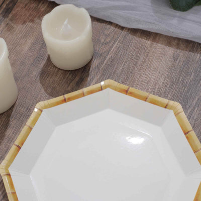 Octagonal white plate with bamboo design on edge, styled with candles.