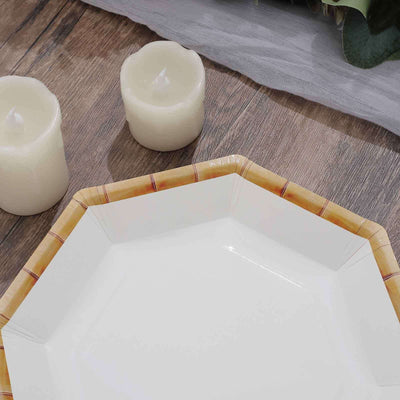Octagonal plate with bamboo design, surrounded by white candles.