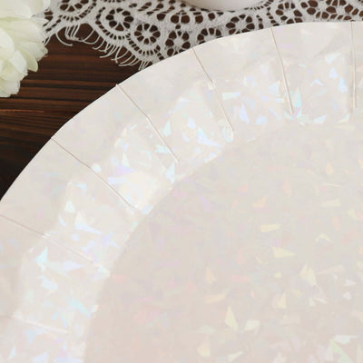 Iridescent disposable plate with a decorative edge on a wooden surface.