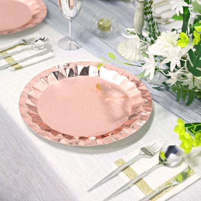 Rose gold paper plate on a dining table with elegant decor.