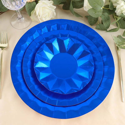 Blue decorative plates stacked elegantly on a table setting.